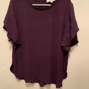 Blouse with bell sleeves.